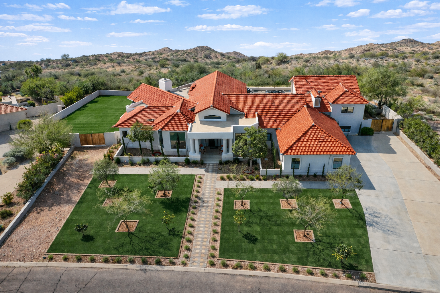 After transformation - lush green turf front yard with desert landscaping