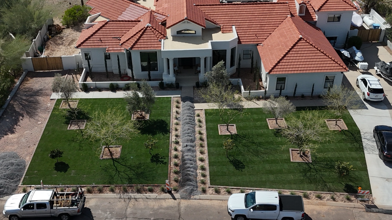 After: two full lawn squares with formal tree pockets